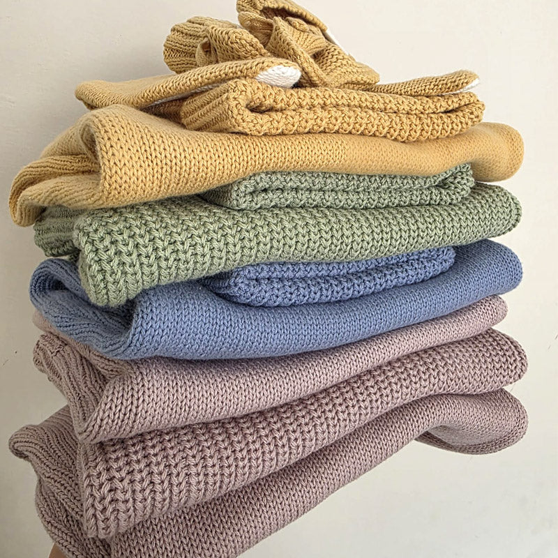 Little Raine Drops personalised Bundles of Chunky Knit Sweaters, Rompers, Blankets, Booties and hats in Ochre, green, dusky Blue and dusky lilac. Baby Showers, gifts and keepsakes