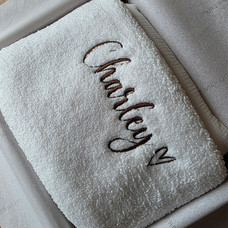 Cosy pearl boucle personalised baby blanket, folded and packaged. Personalised with the name Charley and love heart by little Raine Drops Ireland for beautiful soft keepsake, gift, baby shower gift