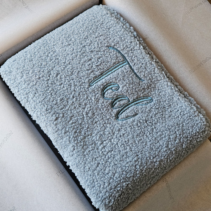 Powder Blue boucle personalised baby blanket, folded and packaged. Personalised with the name Ted by little Raine Drops Ireland for beautiful soft keepsake, gift, baby shower gift