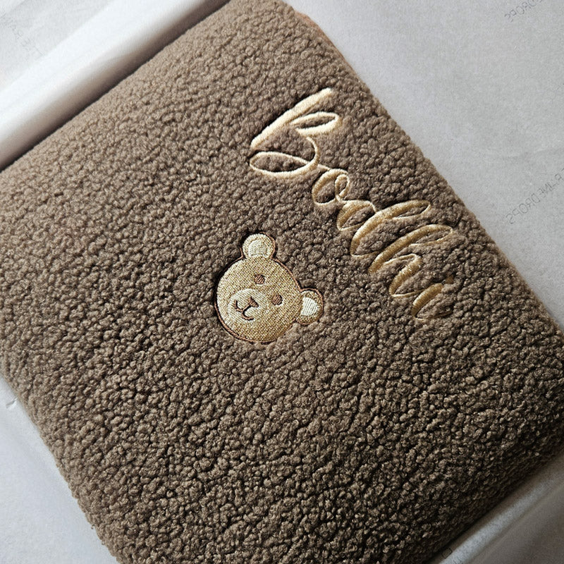 Taupe boucle personalised baby blanket, folded and packaged. Personalised with the name Bodhi and teddy face by little Raine Drops Ireland for beautiful soft keepsake, gift, baby shower gift