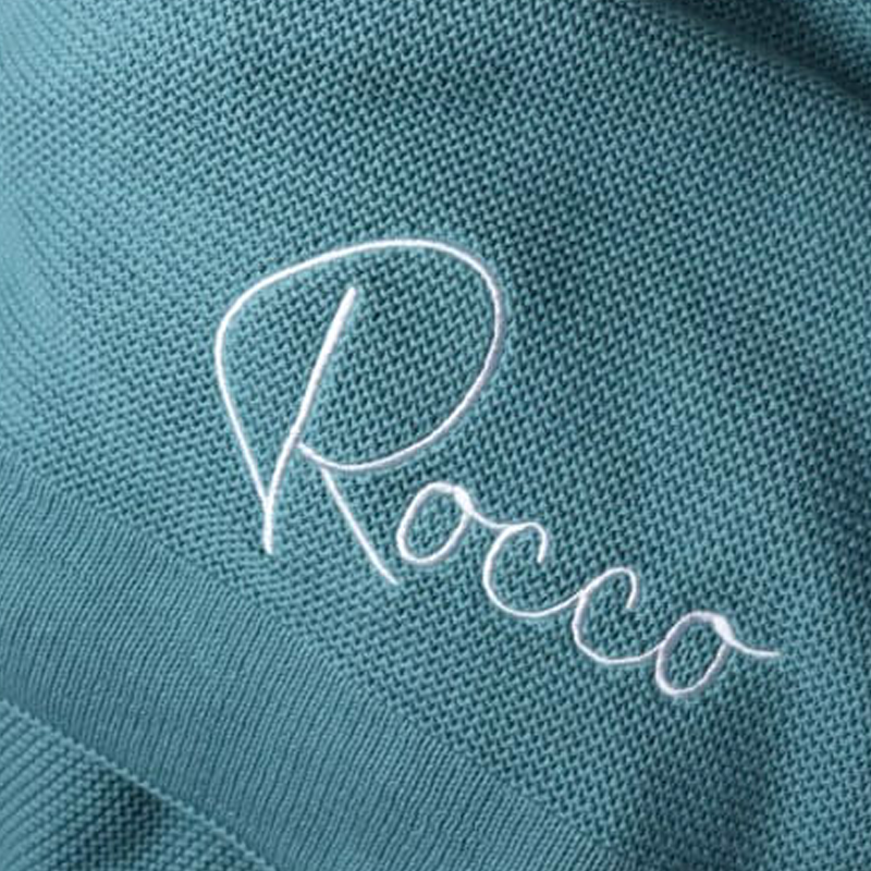 Teal cotton knit blanket personalised with the name Rocco by Little Raine Drops Ireland