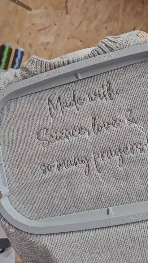 cotton knit grey baby romper, personalised with "made with science, love & so many prayers" by Little Raine Drops Ireland. Personalised romper for keepsake or gift