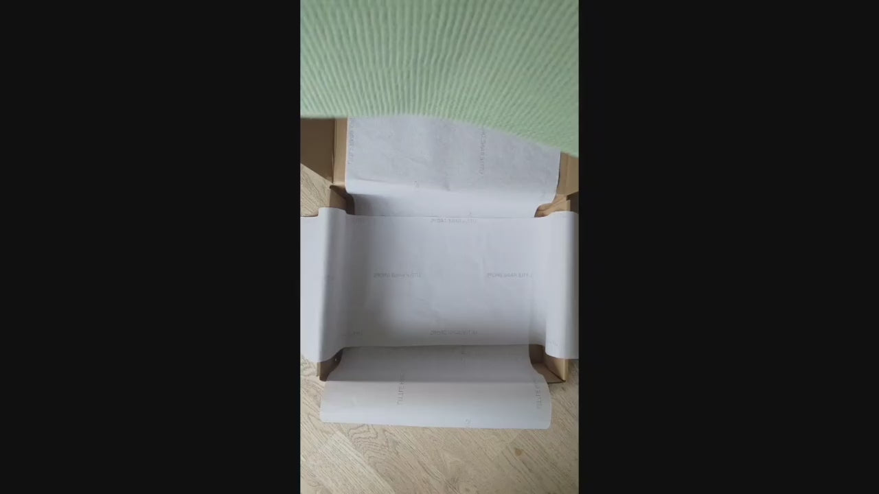 video of Little Raine Drops packaging a Announcement bundle for gifting including a personalised green cotton knit blanket, a personalised pearl cotton knit romper with matching pearl booties and green hat, packaged beautifully with relaxing music